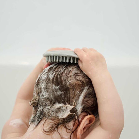 Immagine di Haakaa® Spazzola per shampoo in silicone 
